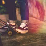 person standing beside skateboard