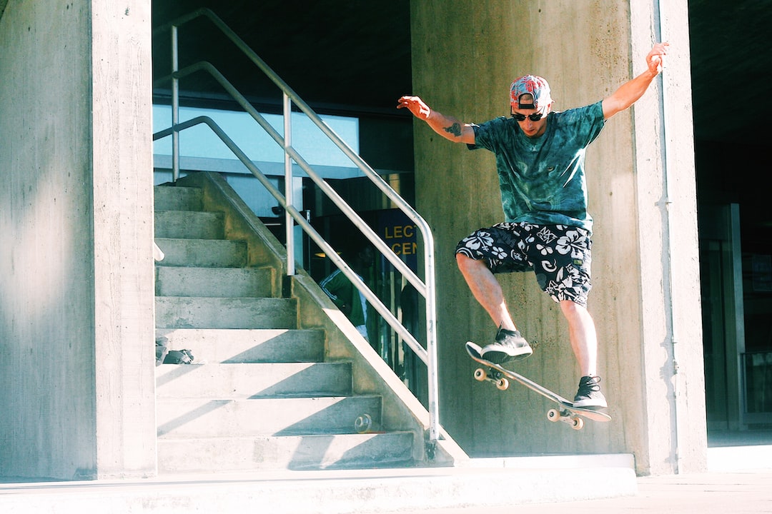 FAQ by Skateboard Brands man skateboarding near stairs during daytime