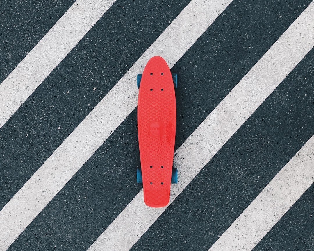 I took my cruiser deck to my latest trip to Budapest, and it’s one of the best ways to experience the city (besides bike of course)! by Skateboard Brands red cruiserboard on gray and white pedestrian lane