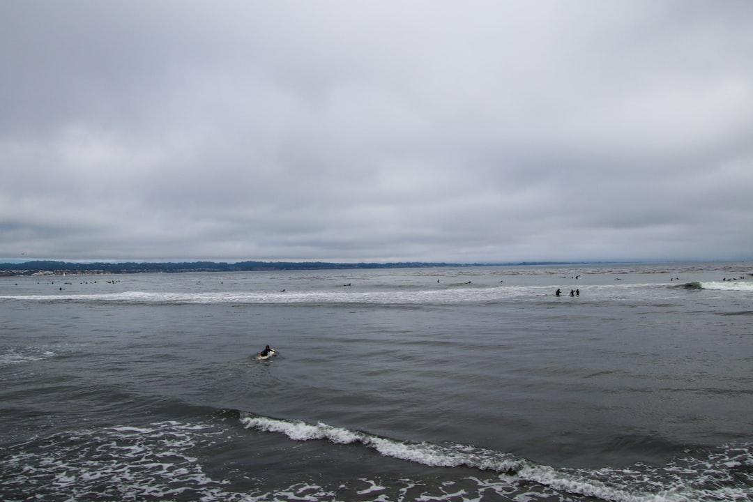 A person riding a surfboard on a body of water